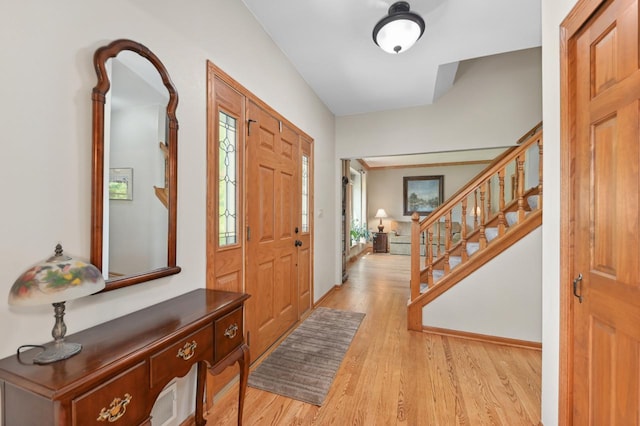 N66W13568 Crestwood Dr, Menomonee Falls, WI 53051 - entrance foyer featuring light wood finished floors and stairway