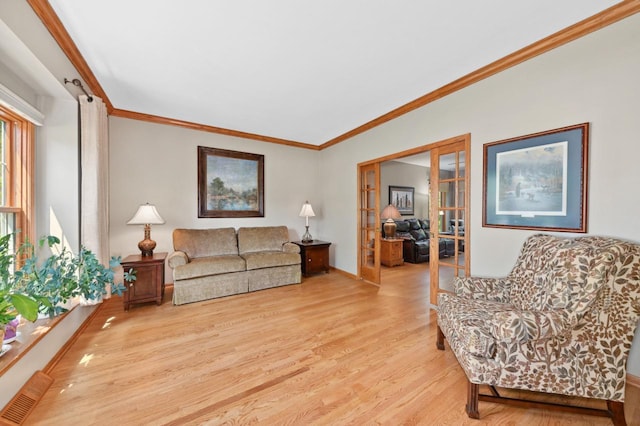 N66W13568 Crestwood Dr, Menomonee Falls, WI 53051 - living room with light wood-style flooring, french doors, and crown molding