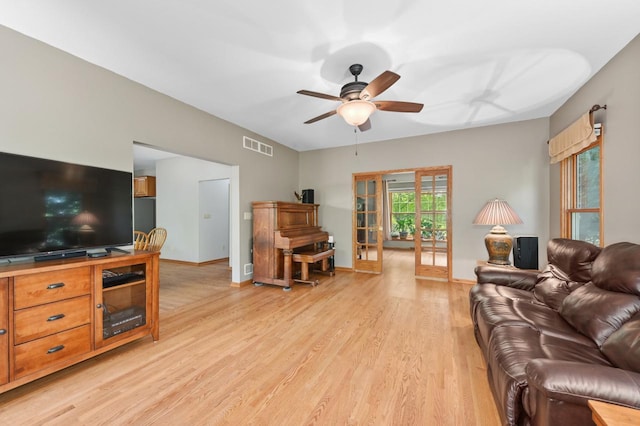 N66W13568 Crestwood Dr, Menomonee Falls, WI 53051 - living area with light wood-style flooring, a ceiling fan, and baseboards