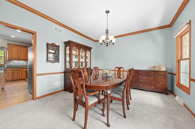N66W13568 Crestwood Dr, Menomonee Falls, WI 53051 - dining space with a chandelier, light carpet, ornamental molding, and baseboards