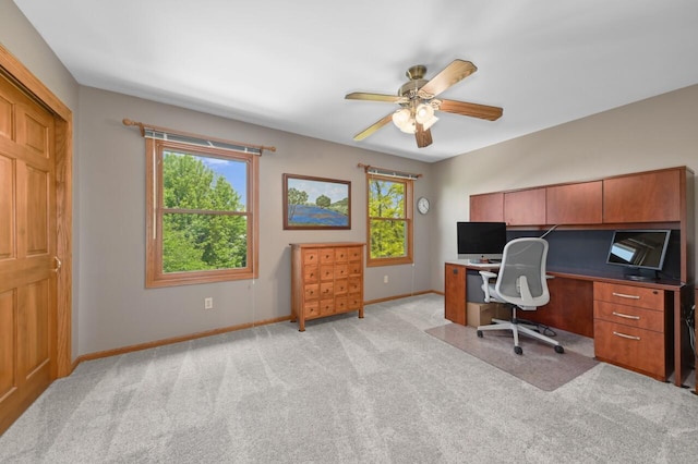 N66W13568 Crestwood Dr, Menomonee Falls, WI 53051 - office area featuring light carpet, baseboards, ceiling fan, and healthy amount of natural light