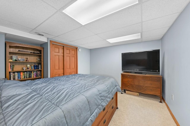 N66W13568 Crestwood Dr, Menomonee Falls, WI 53051 - bedroom with light colored carpet, a paneled ceiling, baseboards, and a closet