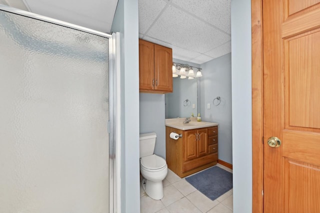 N66W13568 Crestwood Dr, Menomonee Falls, WI 53051 - full bathroom with a shower stall, tile patterned floors, toilet, vanity, and a paneled ceiling