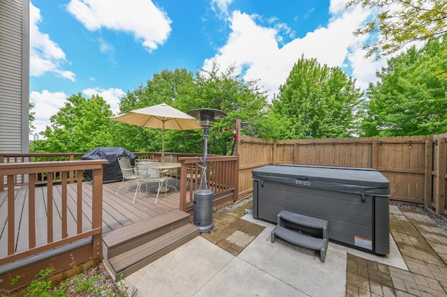 N66W13568 Crestwood Dr, Menomonee Falls, WI 53051 - wooden deck featuring a hot tub, outdoor dining area, grilling area, and a patio