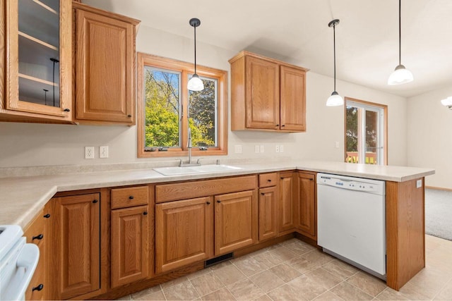 2225 Paul Rd, Manitowoc, WI 54220 - kitchen featuring dishwasher, a sink, healthy amount of natural light, and a peninsula