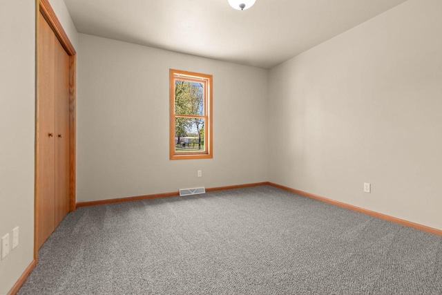 2225 Paul Rd, Manitowoc, WI 54220 - unfurnished bedroom with carpet, baseboards, and a closet
