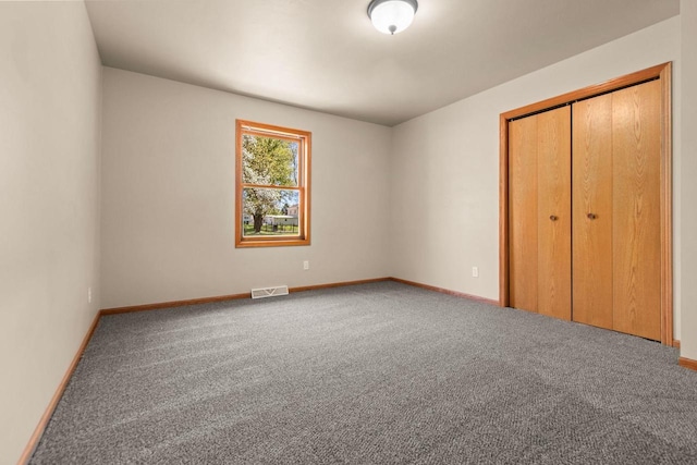 2225 Paul Rd, Manitowoc, WI 54220 - unfurnished bedroom with carpet floors, baseboards, and a closet