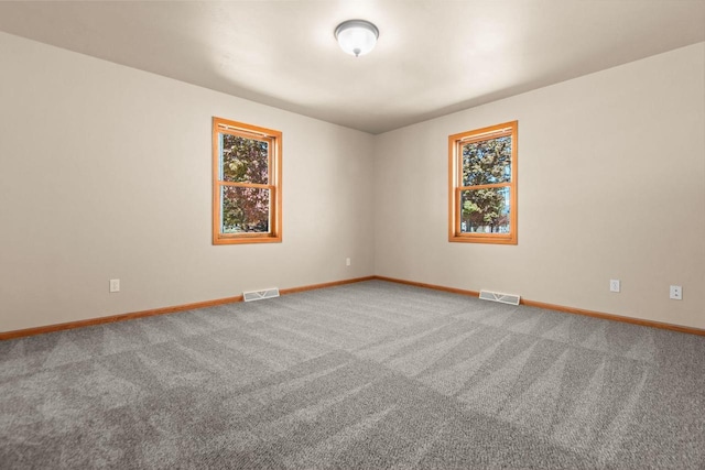 2225 Paul Rd, Manitowoc, WI 54220 - spare room featuring baseboards and carpet floors