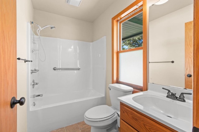 2225 Paul Rd, Manitowoc, WI 54220 - bathroom featuring vanity, toilet, shower / bathtub combination, and tile patterned floors
