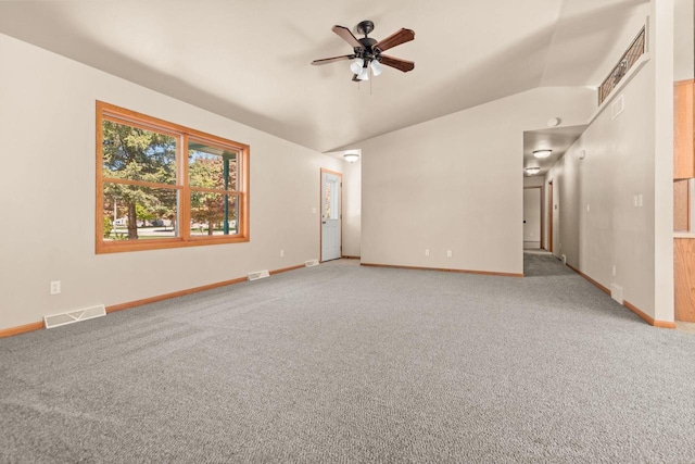 2225 Paul Rd, Manitowoc, WI 54220 - carpeted empty room featuring a ceiling fan, baseboards, and vaulted ceiling