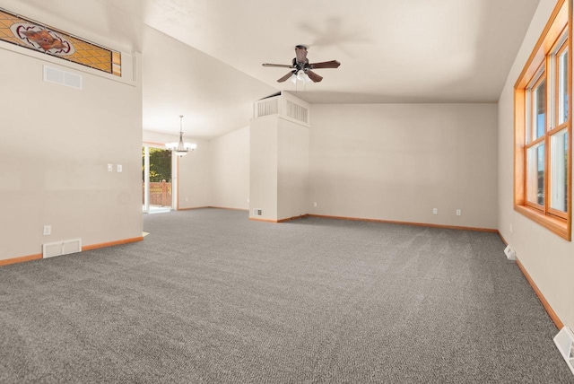 2225 Paul Rd, Manitowoc, WI 54220 - carpeted spare room featuring a ceiling fan, a chandelier, baseboards, and vaulted ceiling