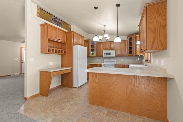 2225 Paul Rd, Manitowoc, WI 54220 - kitchen with white appliances, a sink, a peninsula, light countertops, and glass insert cabinets