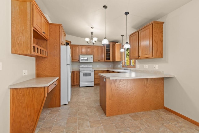 2225 Paul Rd, Manitowoc, WI 54220 - kitchen featuring white appliances, a peninsula, a sink, and light countertops