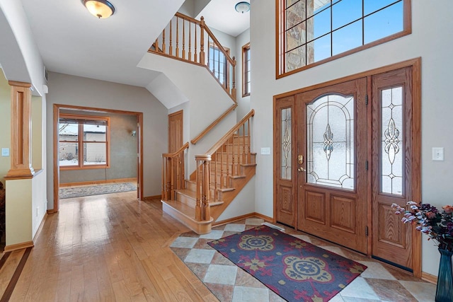 N2281 Lakewood Ln, Chilton, WI 53014 - entrance foyer featuring baseboards, hardwood / wood-style floors, stairs, and a high ceiling