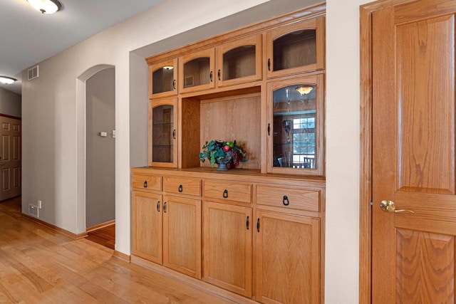 N2281 Lakewood Ln, Chilton, WI 53014 - detailed view of wood finished floors, arched walkways, and baseboards