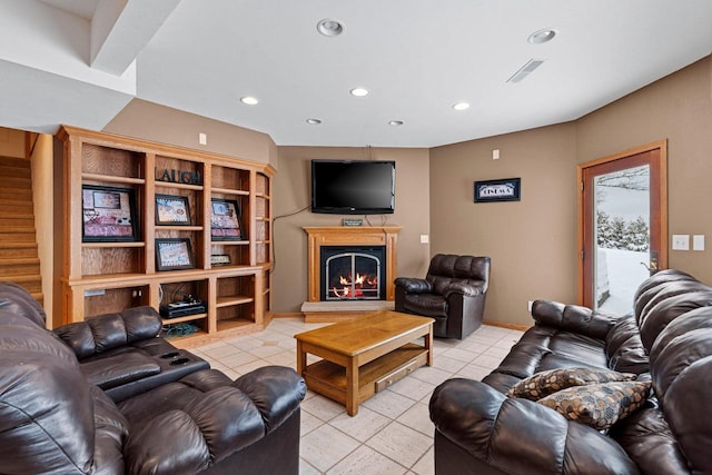 N2281 Lakewood Ln, Chilton, WI 53014 - living area with recessed lighting, light tile patterned floors, a warm lit fireplace, and stairway