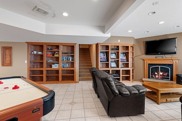 N2281 Lakewood Ln, Chilton, WI 53014 - living room featuring light tile patterned floors, recessed lighting, stairs, and a warm lit fireplace