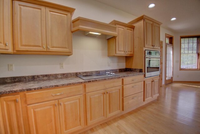 1835 Alpine Pl, Onalaska, WI 54650 - kitchen featuring oven, electric stovetop, light wood-style floors, light brown cabinetry, and recessed lighting