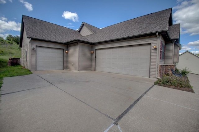 1835 Alpine Pl, Onalaska, WI 54650 - view of front of property featuring an attached garage, driveway, a shingled roof, and brick siding