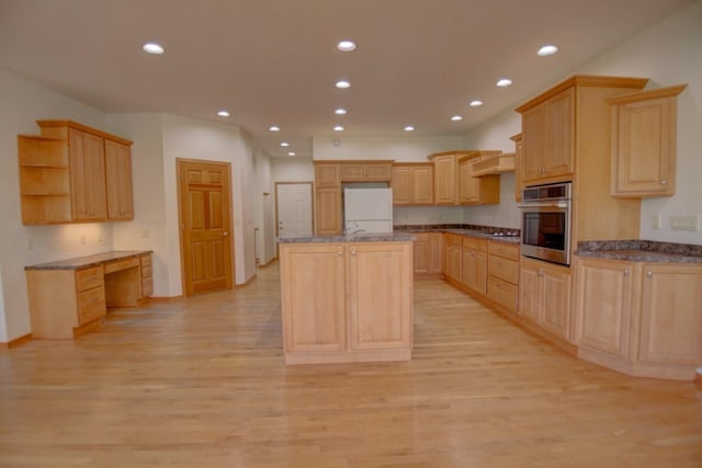 1835 Alpine Pl, Onalaska, WI 54650 - kitchen with oven, light wood-style flooring, light brown cabinetry, recessed lighting, and freestanding refrigerator