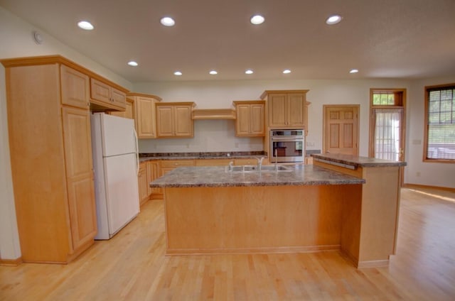 1835 Alpine Pl, Onalaska, WI 54650 - kitchen with freestanding refrigerator, oven, a sink, light wood-style floors, and recessed lighting