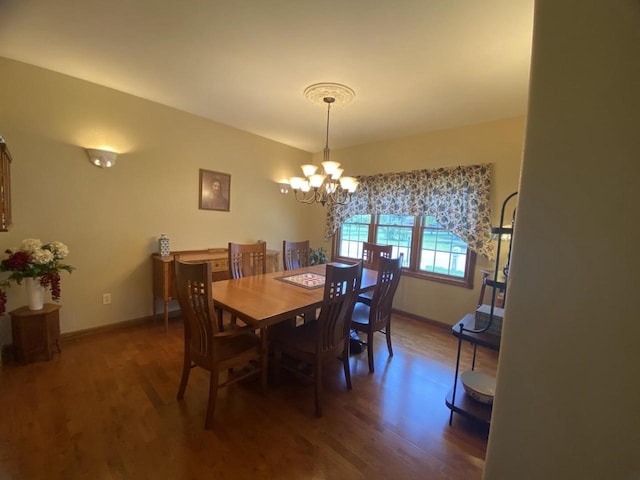 1430 Sherwood Ct, Wisconsin Rapids, WI 54494 - dining area with wood finished floors, a chandelier, and baseboards
