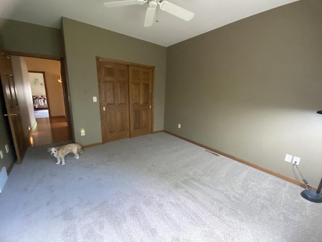 1430 Sherwood Ct, Wisconsin Rapids, WI 54494 - unfurnished bedroom featuring carpet floors, a closet, ceiling fan, and baseboards