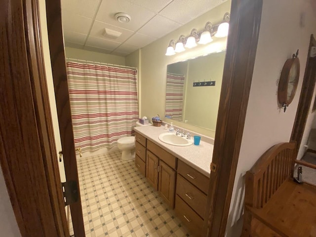 1430 Sherwood Ct, Wisconsin Rapids, WI 54494 - bathroom with vanity, toilet, a paneled ceiling, and a shower with shower curtain