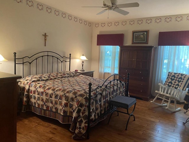 1430 Sherwood Ct, Wisconsin Rapids, WI 54494 - bedroom with wood-type flooring, multiple windows, and ceiling fan