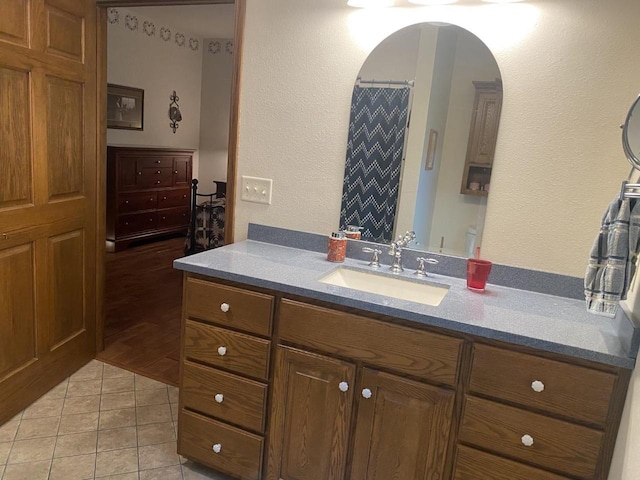 1430 Sherwood Ct, Wisconsin Rapids, WI 54494 - full bath with vanity, tile patterned floors, and a textured wall