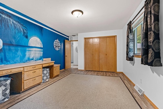 1037 S Union St, Shawano, WI 54166 - foyer with light wood-style floors, built in desk, and baseboards