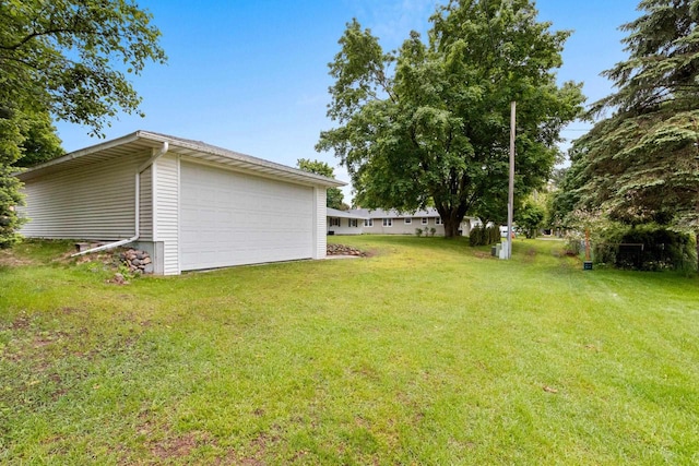 1037 S Union St, Shawano, WI 54166 - view of grassy yard with a garage and an outdoor structure