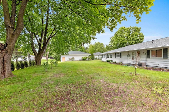 1037 S Union St, Shawano, WI 54166 - view of green lawn featuring central AC