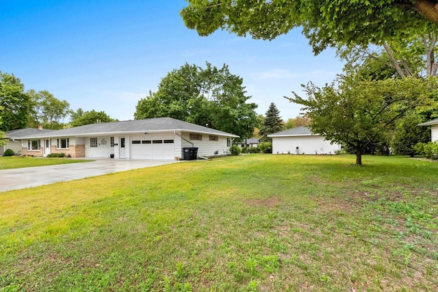 1037 S Union St, Shawano, WI 54166 - view of green lawn featuring an attached garage and driveway
