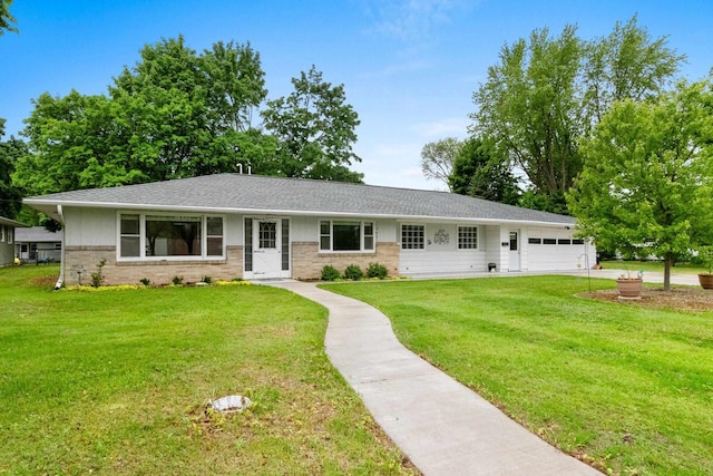 1037 S Union St, Shawano, WI 54166 - single story home with an attached garage, a front yard, brick siding, and roof with shingles