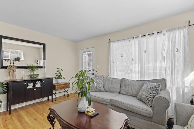 8721 W Douglas Ave, Milwaukee, WI 53225 - living room with light wood-style flooring and baseboards