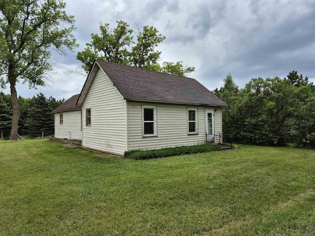 N3922 11th Ave, Hancock, WI 54943 - view of property exterior with a shingled roof and a yard