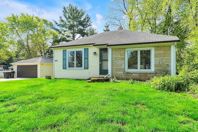 4421 W Johnson Ave, Racine, WI 53405 - bungalow-style home featuring stone siding, a detached garage, a front lawn, and an outdoor structure