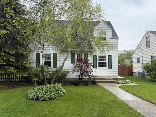 829 W Melin St, Port Washington, WI 53074 - view of front of house with central AC unit and a shingled roof