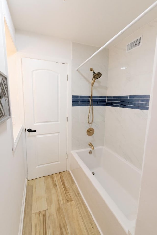 9533 W Silver Spring Dr, Milwaukee, WI 53225 - full bathroom with bathing tub / shower combination and wood finished floors