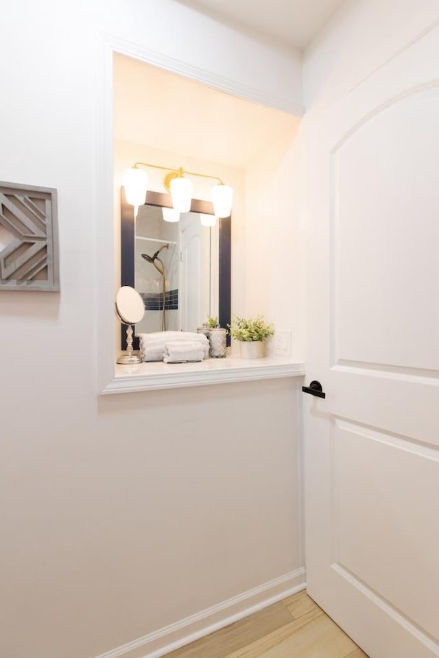 9533 W Silver Spring Dr, Milwaukee, WI 53225 - bathroom with wood finished floors and baseboards