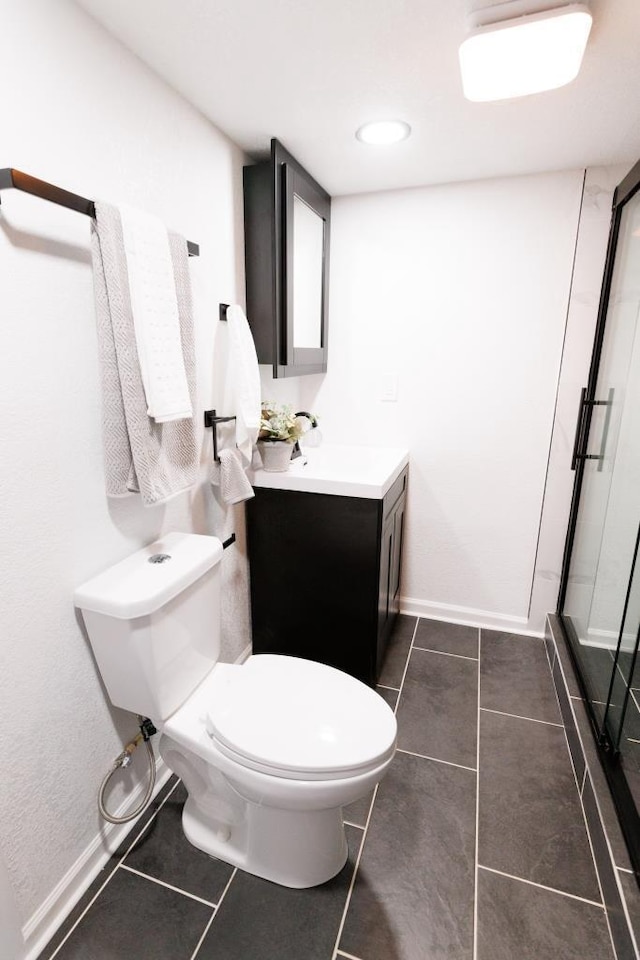 9533 W Silver Spring Dr, Milwaukee, WI 53225 - bathroom with tile patterned floors, toilet, vanity, and a shower stall