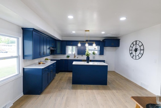 9533 W Silver Spring Dr, Milwaukee, WI 53225 - kitchen featuring blue cabinetry, a sink, a kitchen island, and recessed lighting