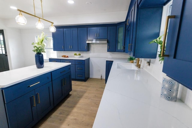 9533 W Silver Spring Dr, Milwaukee, WI 53225 - kitchen featuring a sink, blue cabinets, light wood-style floors, plenty of natural light, and recessed lighting