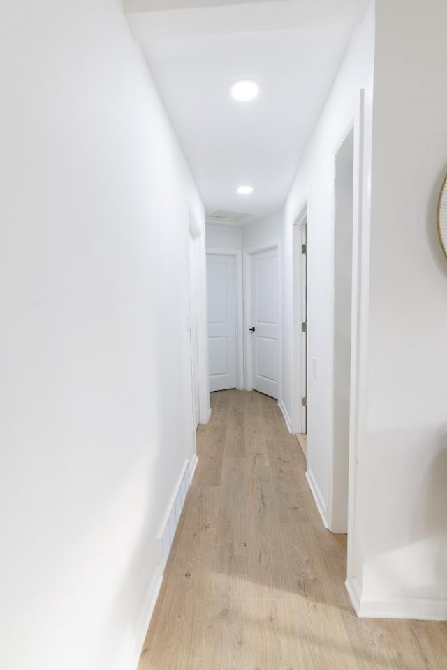 9533 W Silver Spring Dr, Milwaukee, WI 53225 - hall with light wood finished floors, baseboards, and recessed lighting