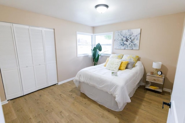 9533 W Silver Spring Dr, Milwaukee, WI 53225 - bedroom with light wood-type flooring, a closet, and baseboards