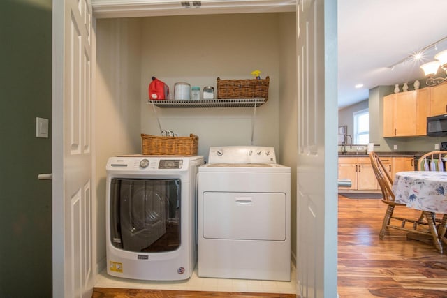 739 Shore Ln, West Bend, WI 53090 - laundry area featuring washing machine and dryer, wood finished floors, and recessed lighting