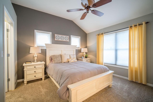 739 Shore Ln, West Bend, WI 53090 - bedroom featuring carpet, multiple windows, vaulted ceiling, baseboards, and ceiling fan