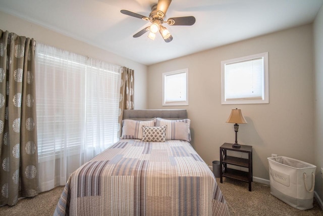 739 Shore Ln, West Bend, WI 53090 - bedroom with carpet flooring, baseboards, and ceiling fan