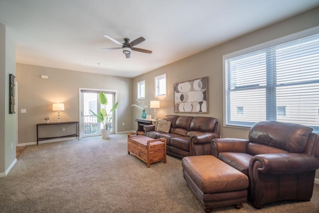 739 Shore Ln, West Bend, WI 53090 - carpeted living area featuring a ceiling fan and baseboards